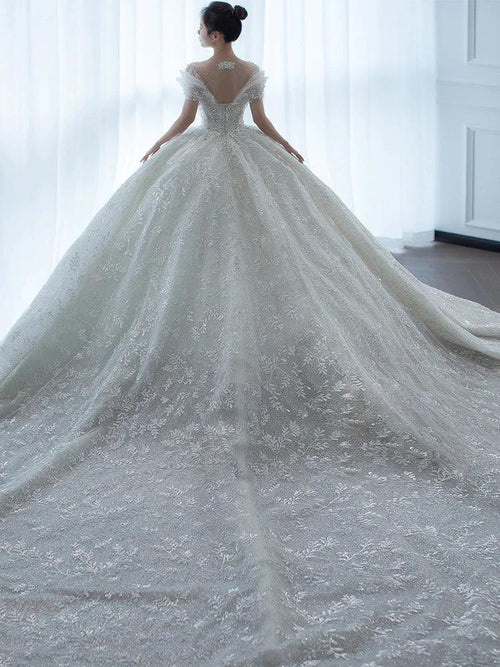 Off shoulder French main wedding dress by MANDOTOS, featuring elegant fabric and classic design perfect for bridal attire.