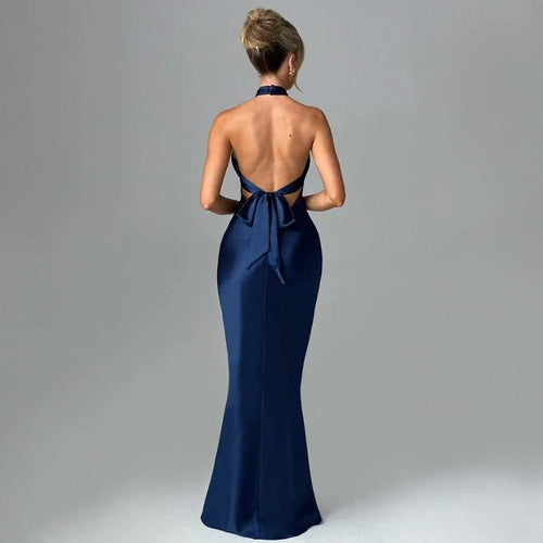 Elegant backless sleeveless summer dress by MANDOTOS, showcasing a flowing fabric and stylish design perfect for warm weather.