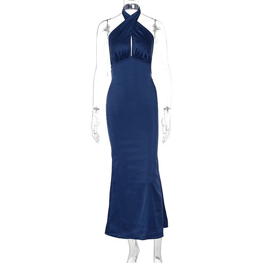 Elegant backless sleeveless summer dress by MANDOTOS, featuring a flowy design ideal for warm weather and stylish occasions.