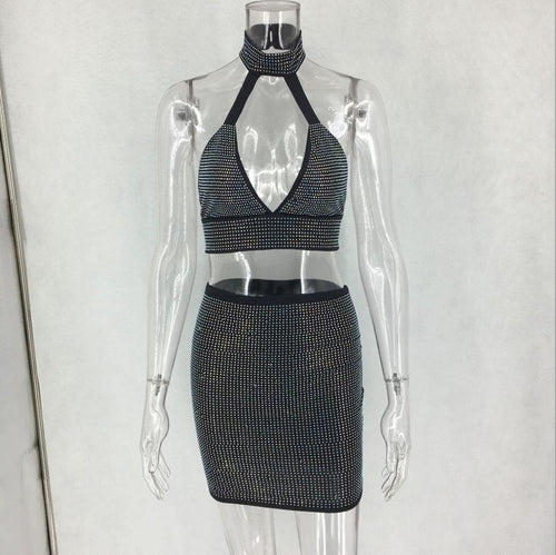 Women’s two-piece dress set with diamond embellishments by MANDOTOS, featuring a stylish top and matching skirt.