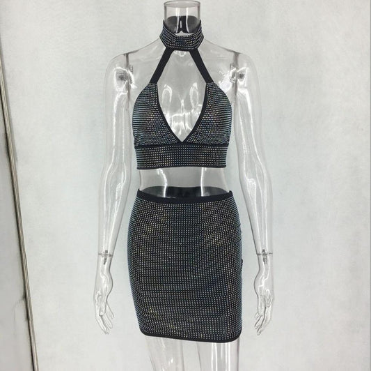 Women’s two-piece dress set with diamond embellishments by MANDOTOS, featuring a stylish top and matching skirt.