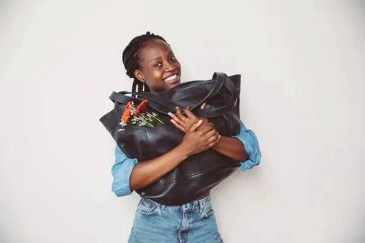 Women's soft leather portable shoulder bag with pocket, vintage style, by MANDOTOS, featuring a sleek design and practical storage.