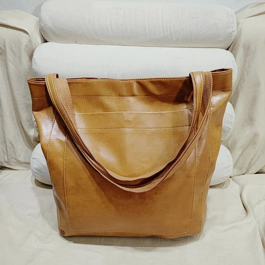 Women's soft leather shoulder bag with pocket, vintage style from MANDOTOS, featuring a compact and portable design.