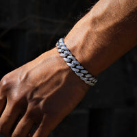 12mm white gold diamond Cuban link bracelet by MANDOTOS, featuring a sleek, luxurious design with sparkling diamonds and a secure clasp.
