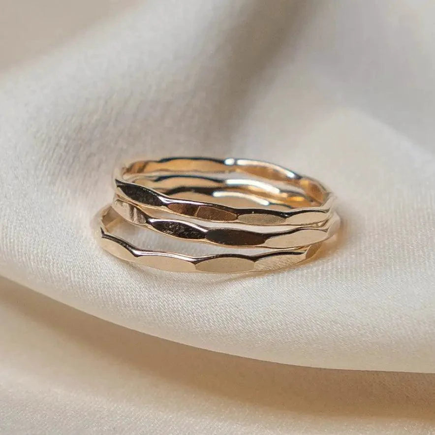 14K gold-filled textured stacking ring by MANDOTOS featuring a polished, intricate design on a sleek band.