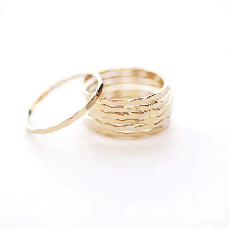 14K gold-filled textured stacking ring by MANDOTOS, showcasing a close-up of the detailed, hammered surface and sleek band design.