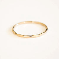 14K gold-filled textured stacking ring by MANDOTOS, close-up of band with hammered finish and layered design.