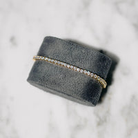 18K gold-plated zircon tennis bracelet by MANDOTOS featuring sparkling cubic zirconia stones on a delicate chain