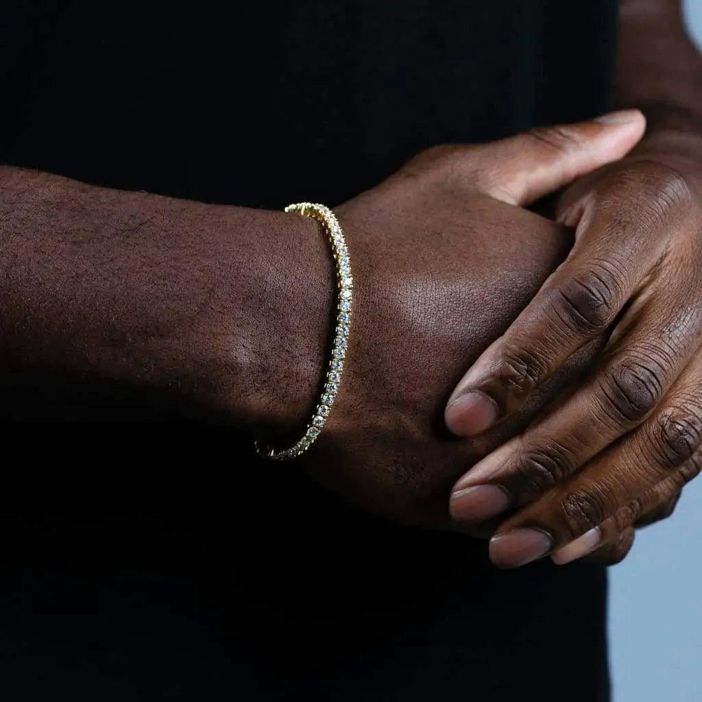 18K gold plated zircon tennis bracelet by MANDOTOS with sparkling cubic zirconia stones on a delicate chain.