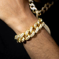 20mm luxury gold Cuban bracelet by MANDOTOS featuring thick, polished gold links on a sleek jewelry display.