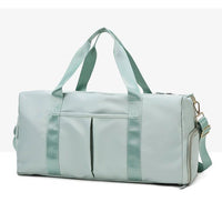 Mandotos waterproof fitness sports travel duffel bag with shoulder strap, ideal for gym, swim, and weekend trips for women and men.