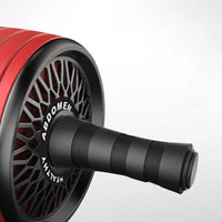 Mandotos ab roller wheel with knee pads for core training, showing the roller and padded knee support on a workout surface.