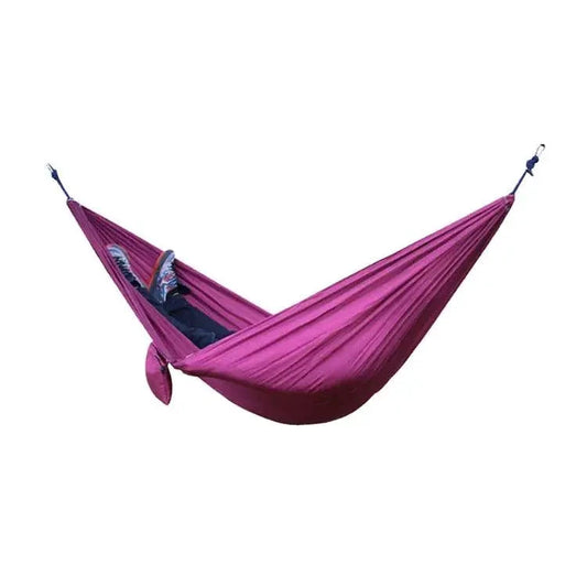 MANDOTOS Adventure Hammock Pack showing a lightweight, portable hammock setup with straps and accessories for outdoor camping and relaxation.