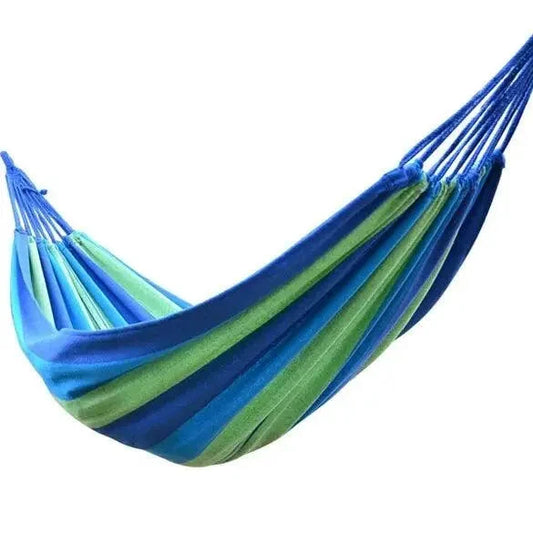 Mandotos Adventure Ready Hammock shown hanging between trees, durable fabric and compact design for outdoor camping and relaxation.