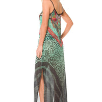 Mandotos Africa long dress featuring vibrant traditional patterns and flowing fabric, perfect for elegant cultural occasions.