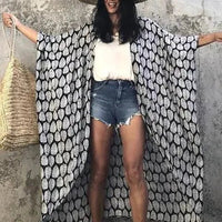 Mandotos Beach Chic Cover-Up with lightweight fabric and stylish design, perfect for sun-kissed beach adventures.