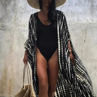 Mandotos Beach Chic Cover-Up with lightweight fabric, stylish design, perfect for sun-kissed beach adventures.