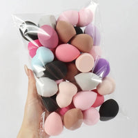 Set of 6 to 60 MANDOTOS beauty sponges and foundation mixing puffs, soft and versatile for flawless makeup application.