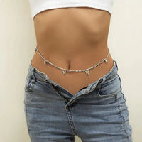 Mandotos Boho Glam Belly Chain featuring layered gold-tone designs with beads and charms on a model's midriff.