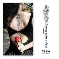 Mandotos botanical spine tattoo decal featuring intricate floral and leaf designs on clear adhesive backing.