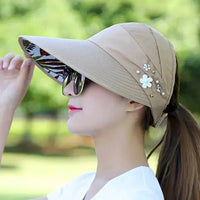 Mandotos Breezy Pearl Visor Hat with wide brim and pearl accents, perfect for sun protection and stylish summer wear.