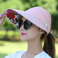 Mandotos Breezy Pearl Visor Hat with wide brim and pearl accents, perfect for sun protection and stylish outdoor wear.