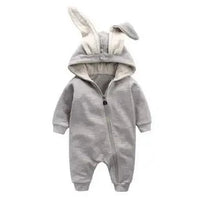 Pink bunny ear baby onesie by MANDOTOS, featuring soft fabric and adorable bunny ear hood for infants.