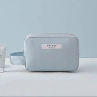 Mandotos Chic Beauty Bag Organizer with multiple compartments for cosmetics and toiletries, compact and stylish for travel.