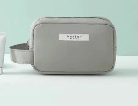 Mandotos Chic Beauty Bag Organizer with multiple compartments, black fabric, and sleek design for travel and storage.