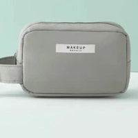 Mandotos Chic Beauty Bag Organizer with multiple compartments for cosmetics and toiletries, compact and stylish design.