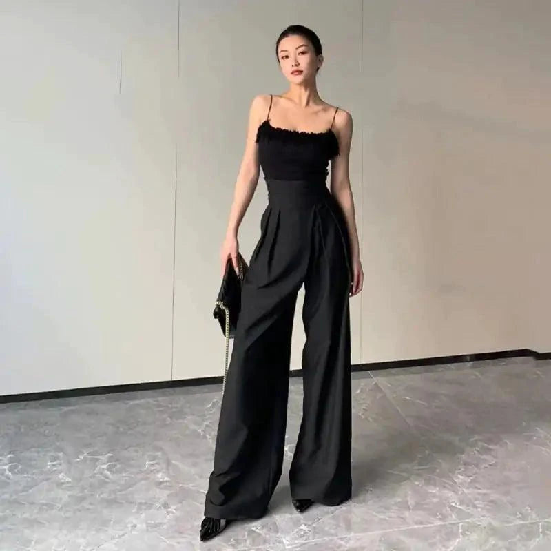 Mandotos chic flowy wide-leg trousers in lightweight fabric, featuring a relaxed fit and elegant drape for stylish comfort.