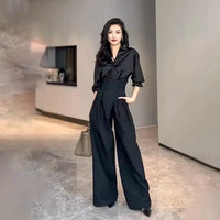 Mandotos chic flowy wide-leg trousers, lightweight fabric, high waist, and relaxed fit, perfect for stylish casual wear.