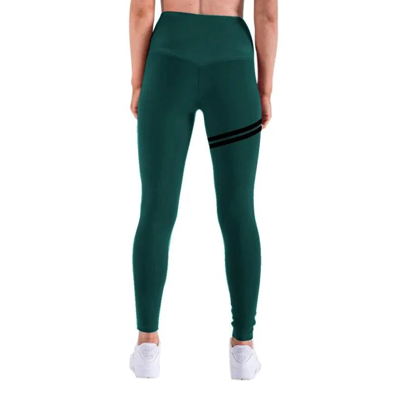 Mandotos chic gold print leggings showing a close-up of the stylish gold pattern on black fabric.
