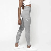 Mandotos chic gold print leggings featuring a stylish pattern, close-up view of the vibrant gold design on soft stretchy fabric.