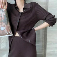 Mandotos chic knit collared ensemble featuring a cozy sweater and matching skirt, perfect for stylish casual wear.