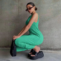 Mandotos chic knitted tank sweater dress featuring a fitted design and cozy texture, perfect for casual and stylish winter wear.