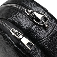 Mandotos chic leather circle purse with a sleek design, featuring a round shape and a stylish finish.