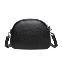 Mandotos chic leather circle purse with a sleek design and zipper closure, perfect for stylish everyday use.