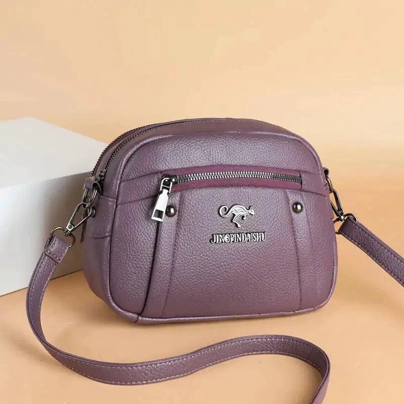 Mandotos chic leather circle purse with sleek design and top handle, perfect for stylish everyday use.