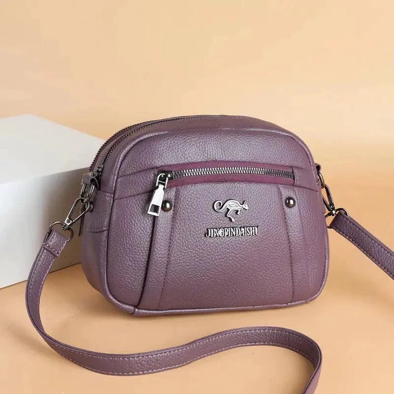 Mandotos chic leather circle purse with a sleek design and silver clasp, perfect for stylish everyday accessories.