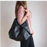 Mandotos chic leather tote handbag with sturdy handles, spacious interior, and sleek design for versatile everyday use.