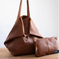 Mandotos chic leather tote handbag with sleek design, featuring sturdy handles and spacious interior for everyday use