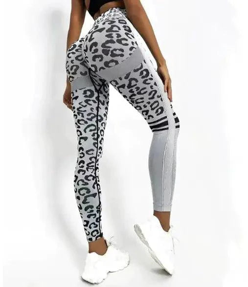 Mandotos chic leopard print high-rise yoga tights laid flat, showcasing stretchy fabric and stylish design for activewear.