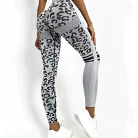 Mandotos chic leopard print high-rise yoga tights laid flat, showing the stylish design and comfortable fit.