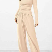 Mandotos chic long-sleeve trousers set featuring a stylish top and matching trousers, perfect for casual or semi-formal wear.