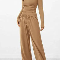 Mandotos chic long-sleeve trousers set featuring a stylish top and matching trousers, perfect for casual or semi-formal wear.