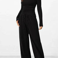 Mandotos chic long-sleeve trousers set featuring a stylish top and matching pants, perfect for casual or semi-formal occasions.