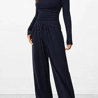 Mandotos chic long-sleeve trousers set featuring a stylish top and matching pants for a modern, sophisticated look.