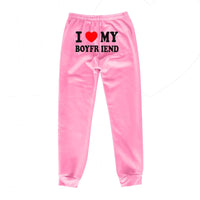 Mandotos Chic Love Print Trousers featuring a stylish love-themed pattern and comfortable fit, ideal for casual or chic outfits.