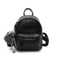 Mandotos chic mini leather backpack with top handle and adjustable shoulder straps, featuring a sleek design and compact size.